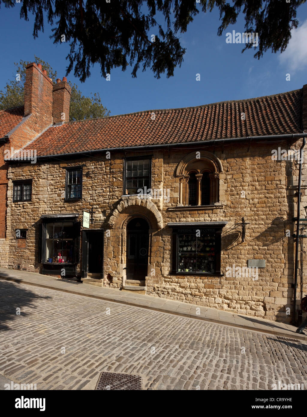 Old cobbled street and traditional shop fronts, STeep Hill, Lincoln, Lincolnshire, England, UK Stock Photo