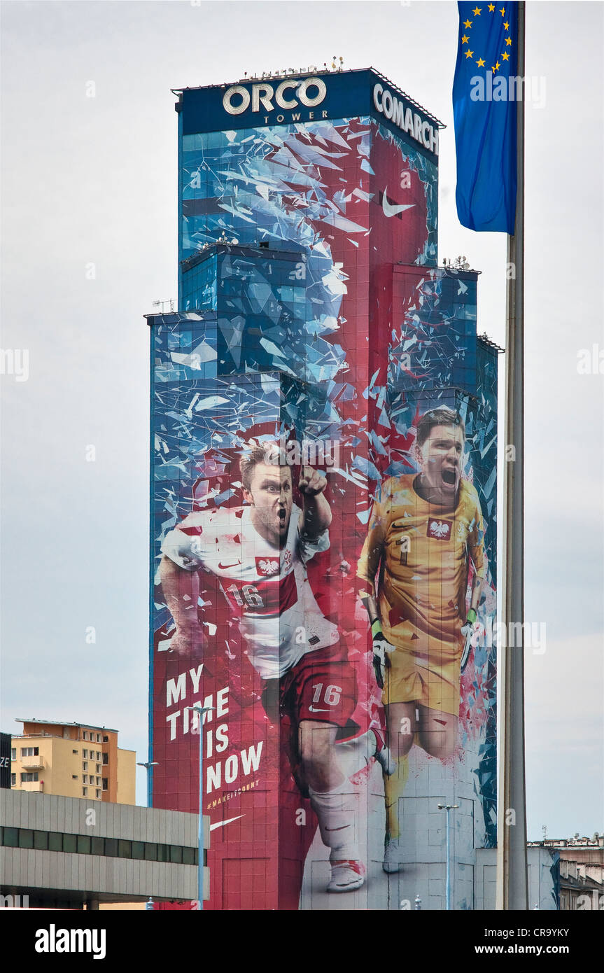 Huge Nike advertisement showing Polish soccer stars, Blaszczykowski and Szczesny, covering 27-floor ORCO Tower in Warsaw, Poland Stock Photo