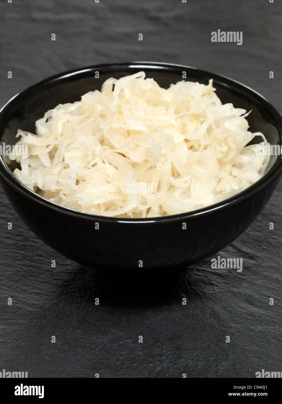 Sauerkraut in Black Bowl Stock Photo