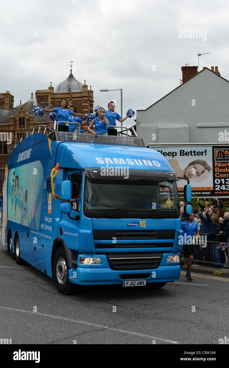 Samsung PR girls on HGV during olympic torch tour of Britain. For editorial  use only Stock Photo - Alamy