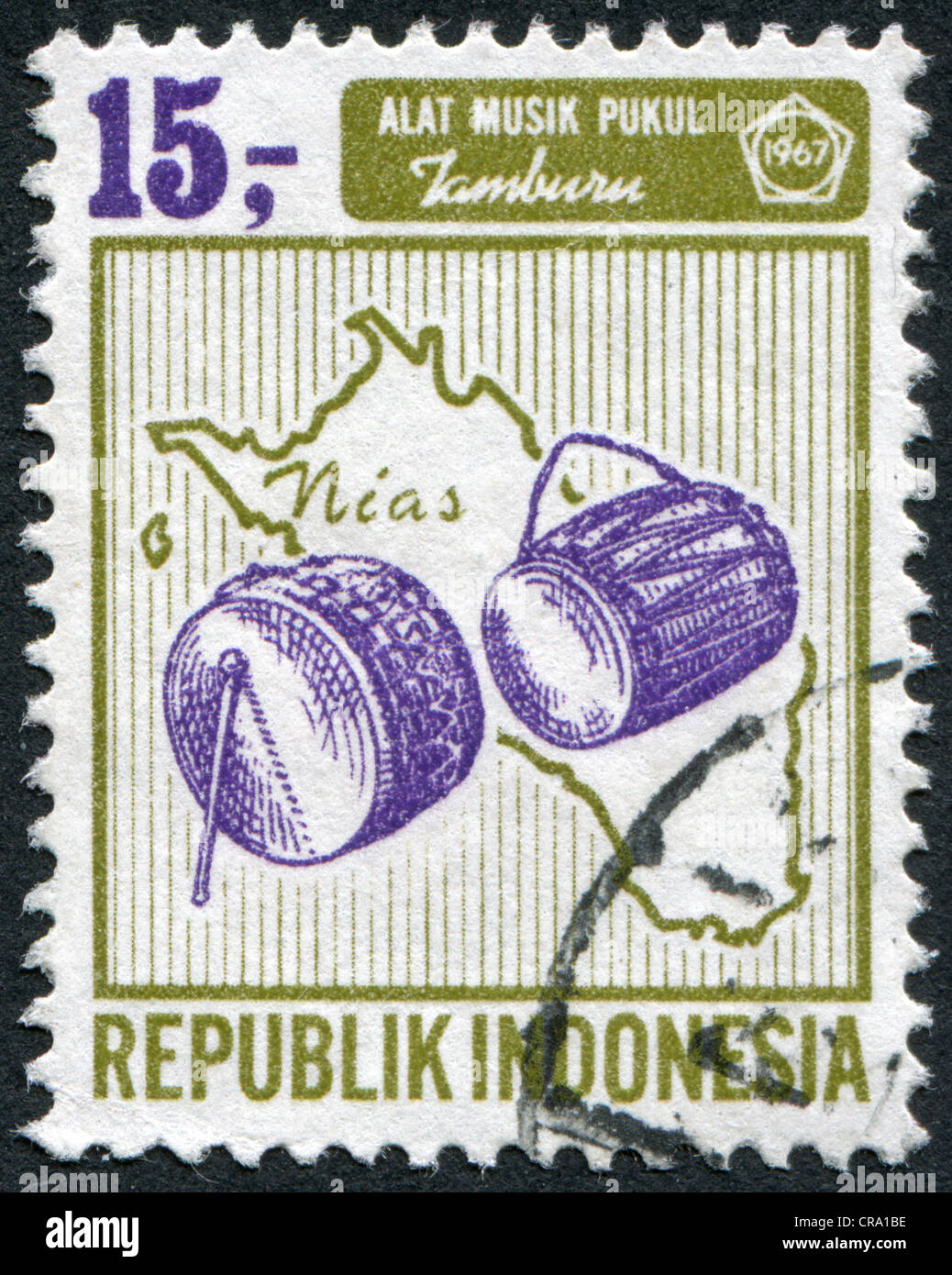 INDONESIA - CIRCA 1967: A stamp printed in the Indonesia, shows a musical instrument drum on a map of Nias, circa 1967 Stock Photo