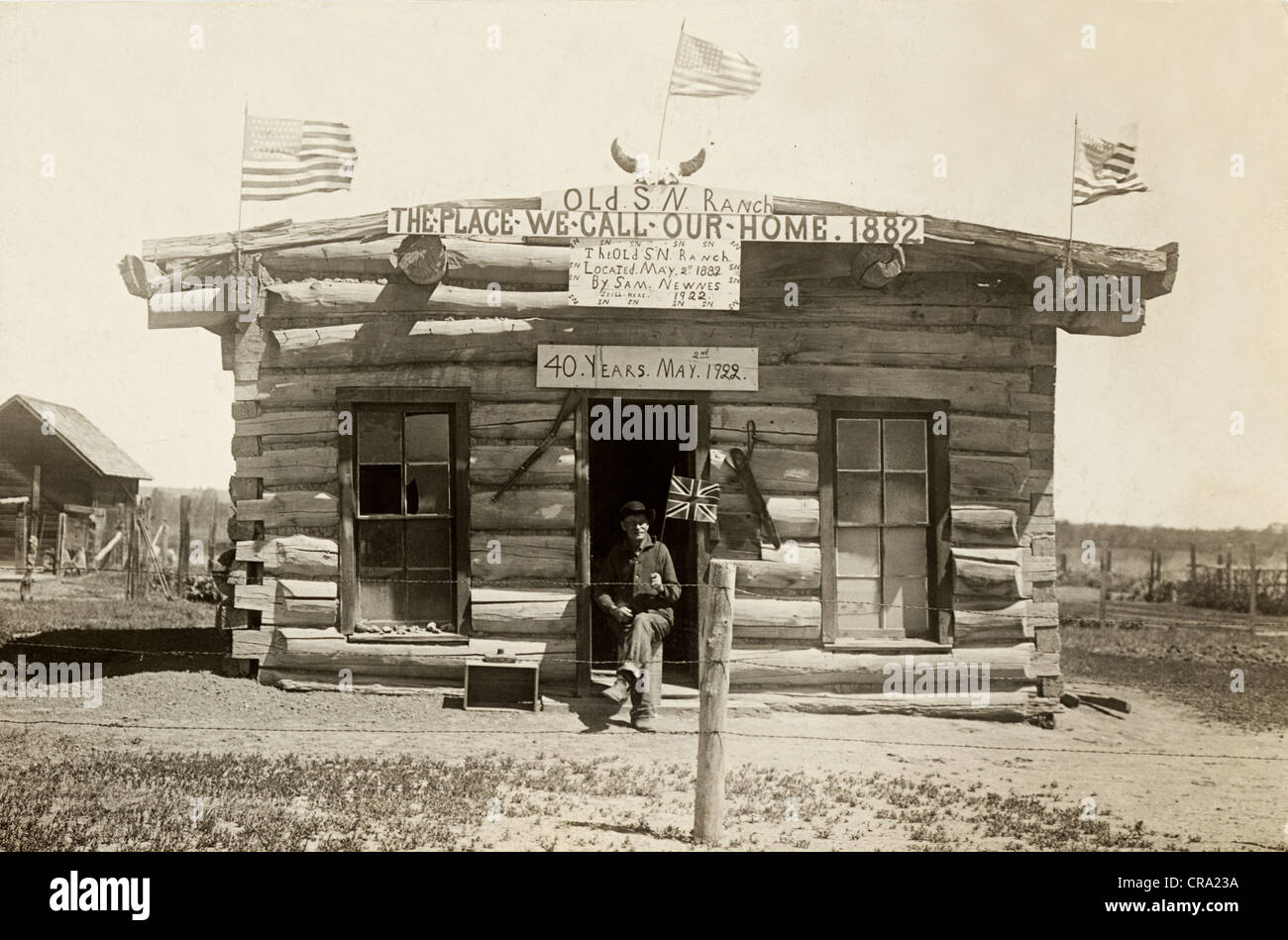 Expatriate British Man At Crude Oklahoma Log Cabin Stock Photo