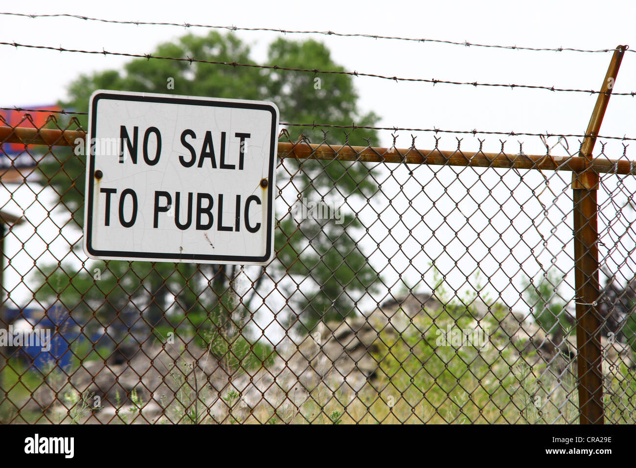 A sign posted on the fence at the Caniff Salt Yard in Detroit, MI indicated that no salt is available to the public. Stock Photo