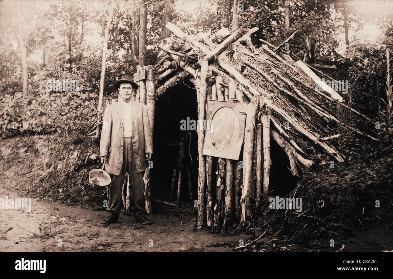 Homeless Man At Primitive Lean To Log Cabin In The Woods Stock
