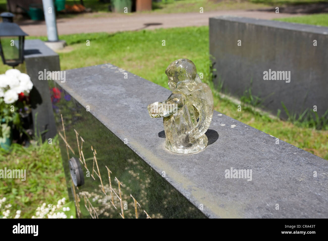 small angel statue on a grave Stock Photo Alamy