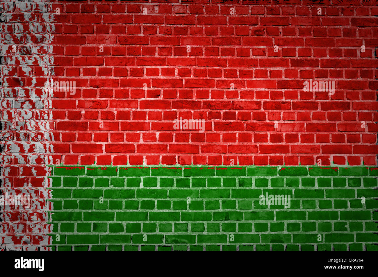 An image of the Belarus flag painted on a brick wall in an urban location Stock Photo