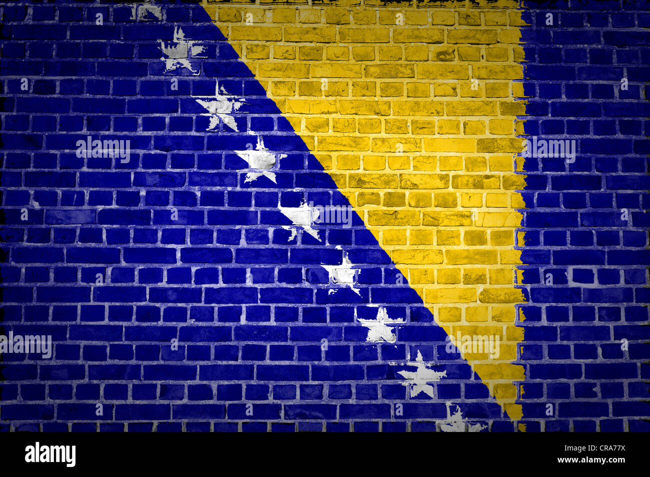 An image of the Bosnia and Herzegovina flag painted on a brick wall in an urban location Stock Photo