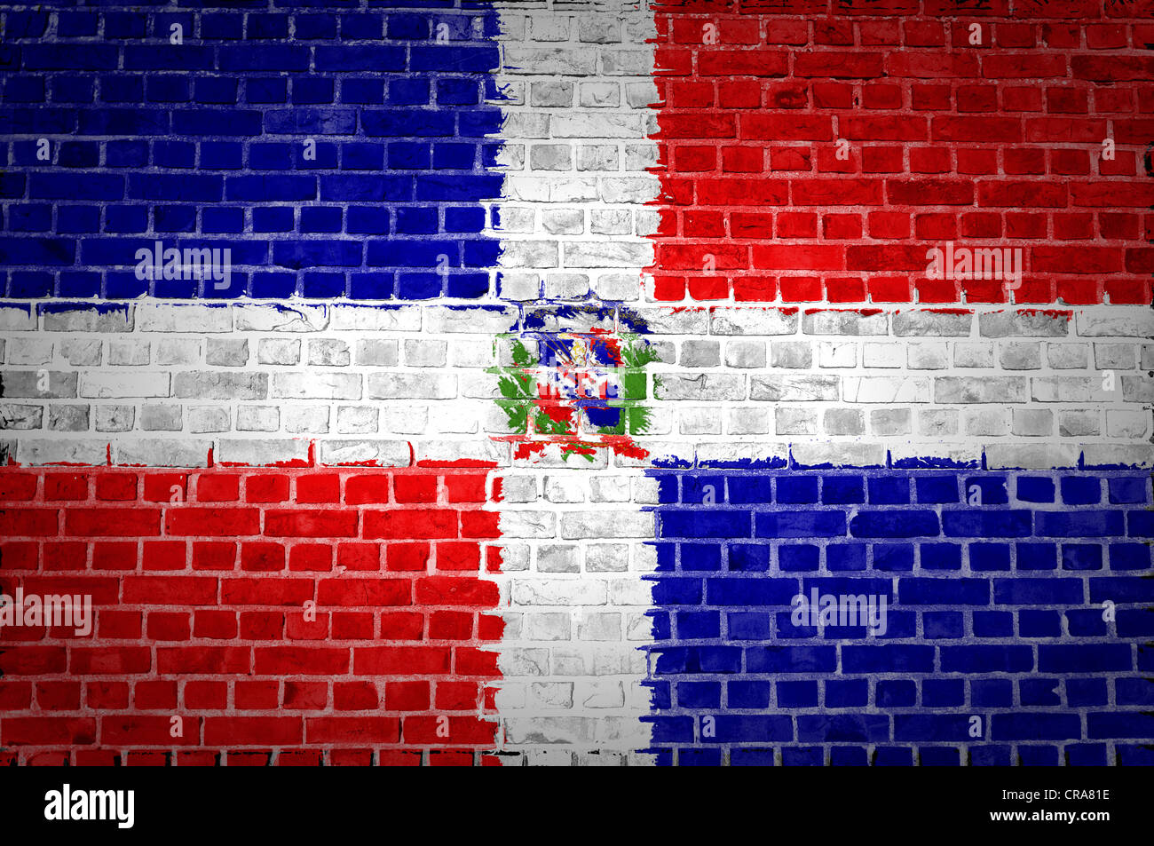 An image of the Dominican Republic flag painted on a brick wall in an urban location Stock Photo