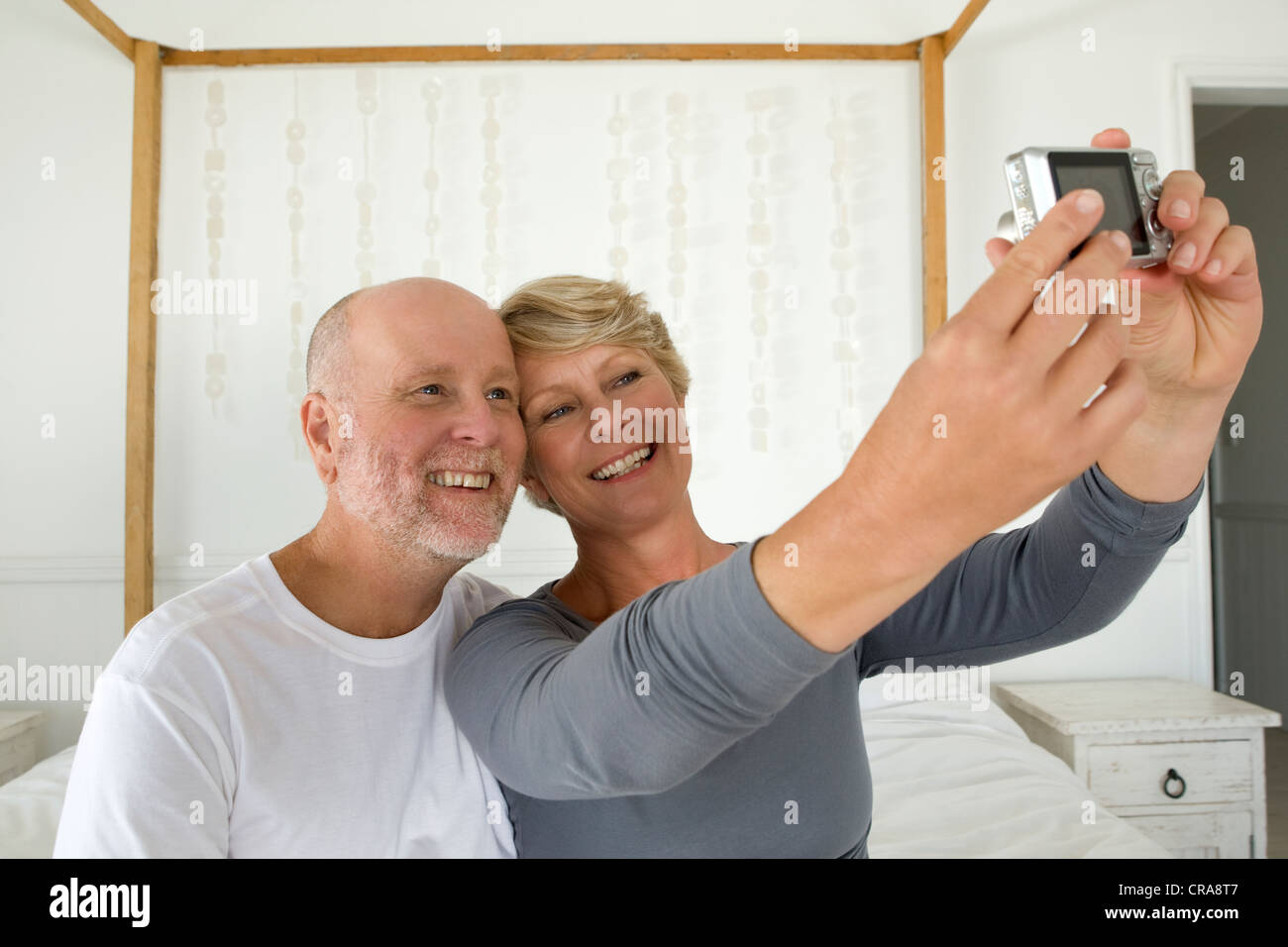 Couple taking pictures of themselves Stock Photo