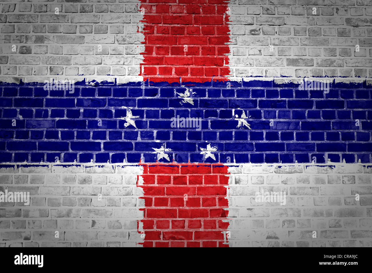 An image of the Netherlands Antilles flag painted on a brick wall in an urban location Stock Photo