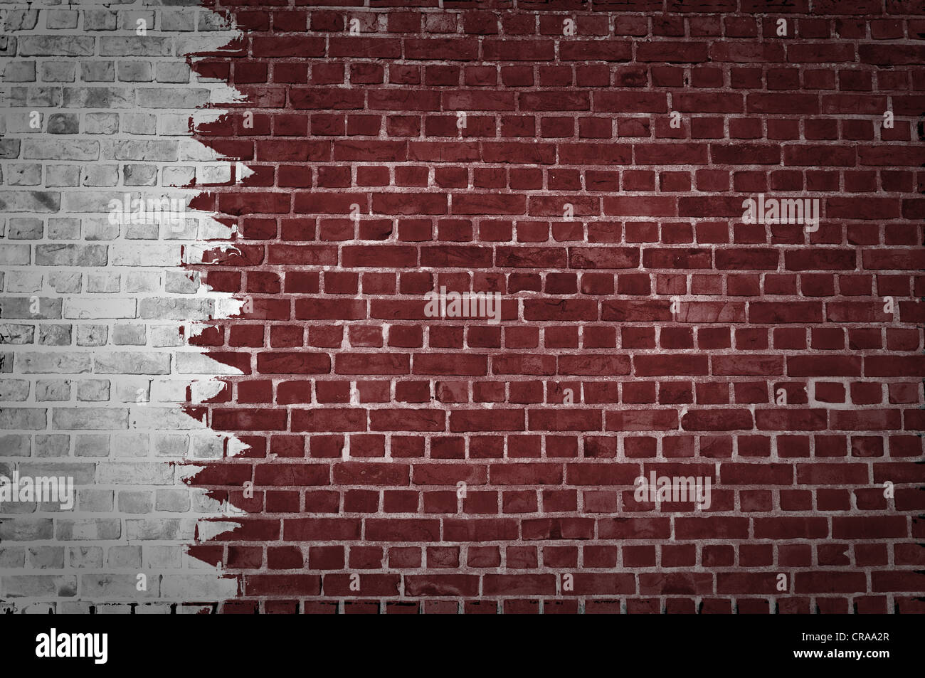 An image of the Qatar flag painted on a brick wall in an urban location ...