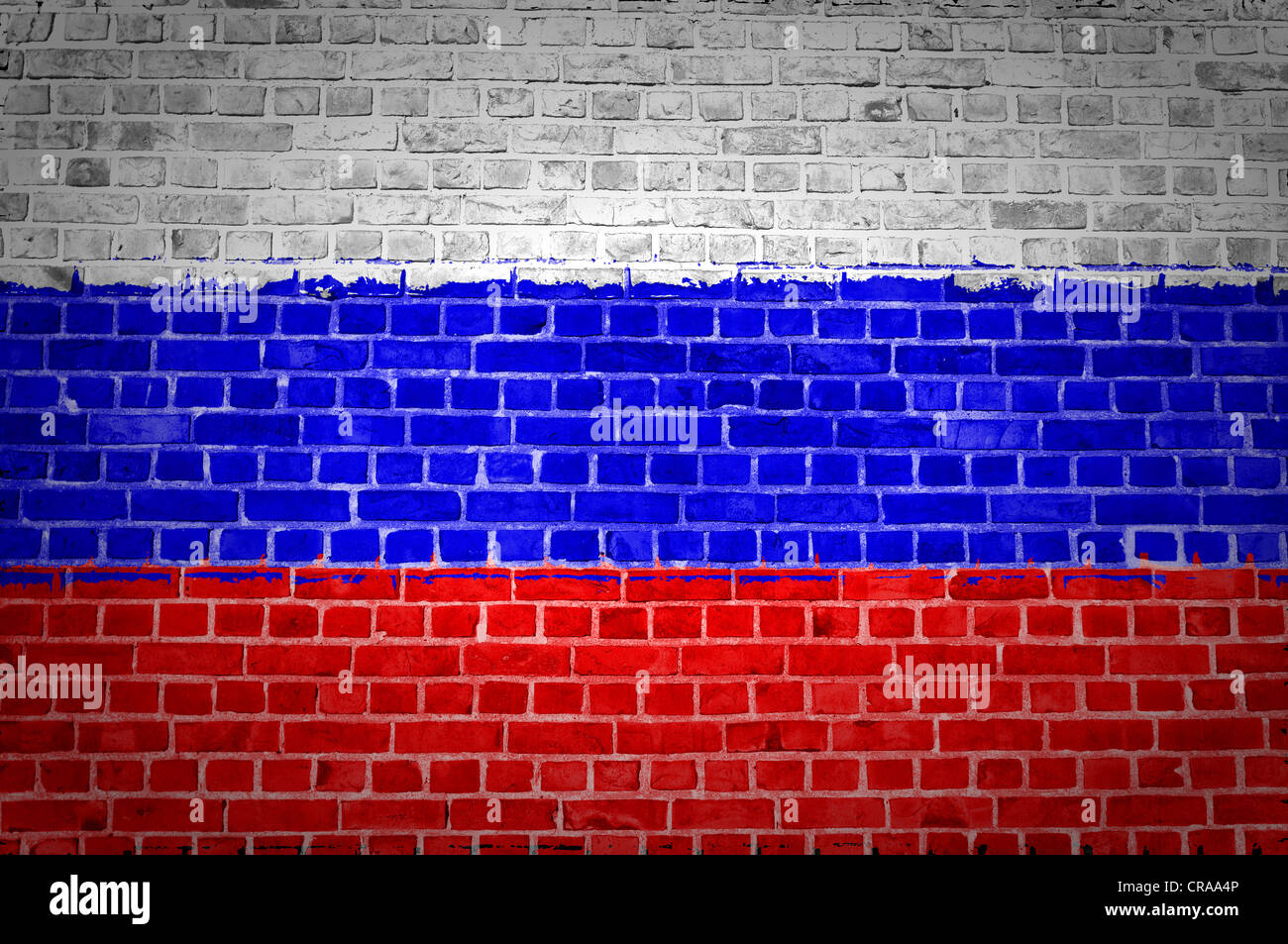 An image of the Russian Federation flag painted on a brick wall in an urban location Stock Photo