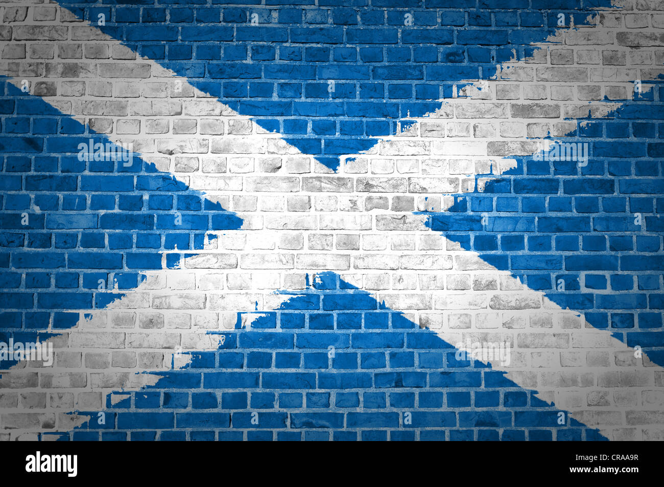 An image of the Scotland Saltire flag painted on a brick wall in an urban location Stock Photo