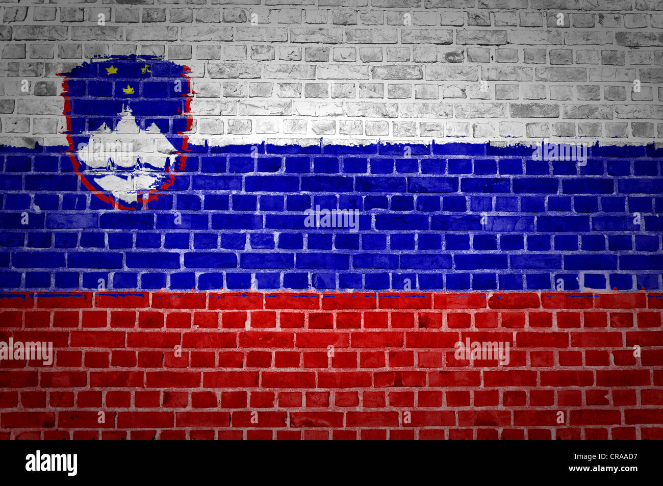 An image of the Slovenia flag painted on a brick wall in an urban ...