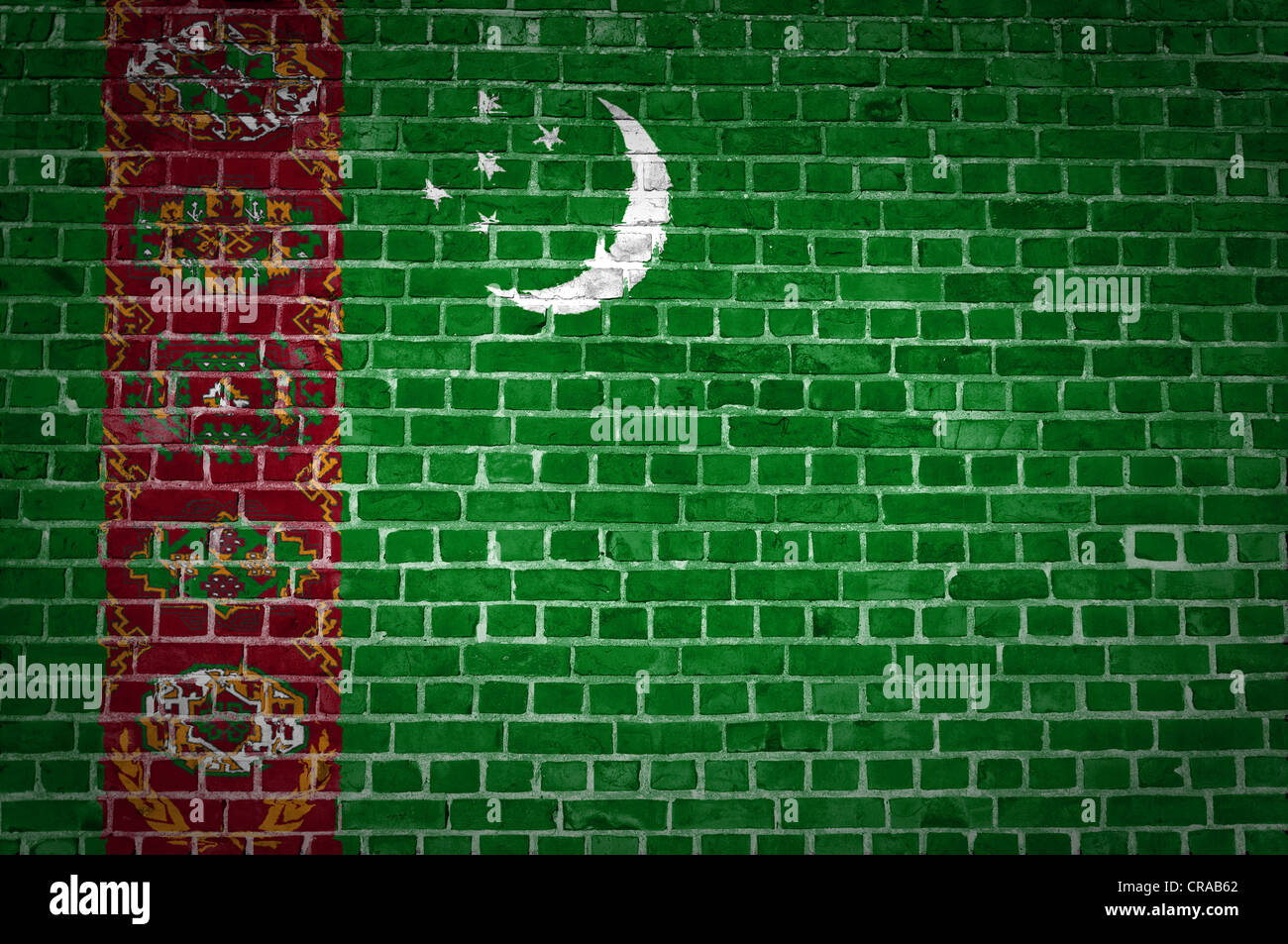 An image of the Turkmenistan flag painted on a brick wall in an urban ...