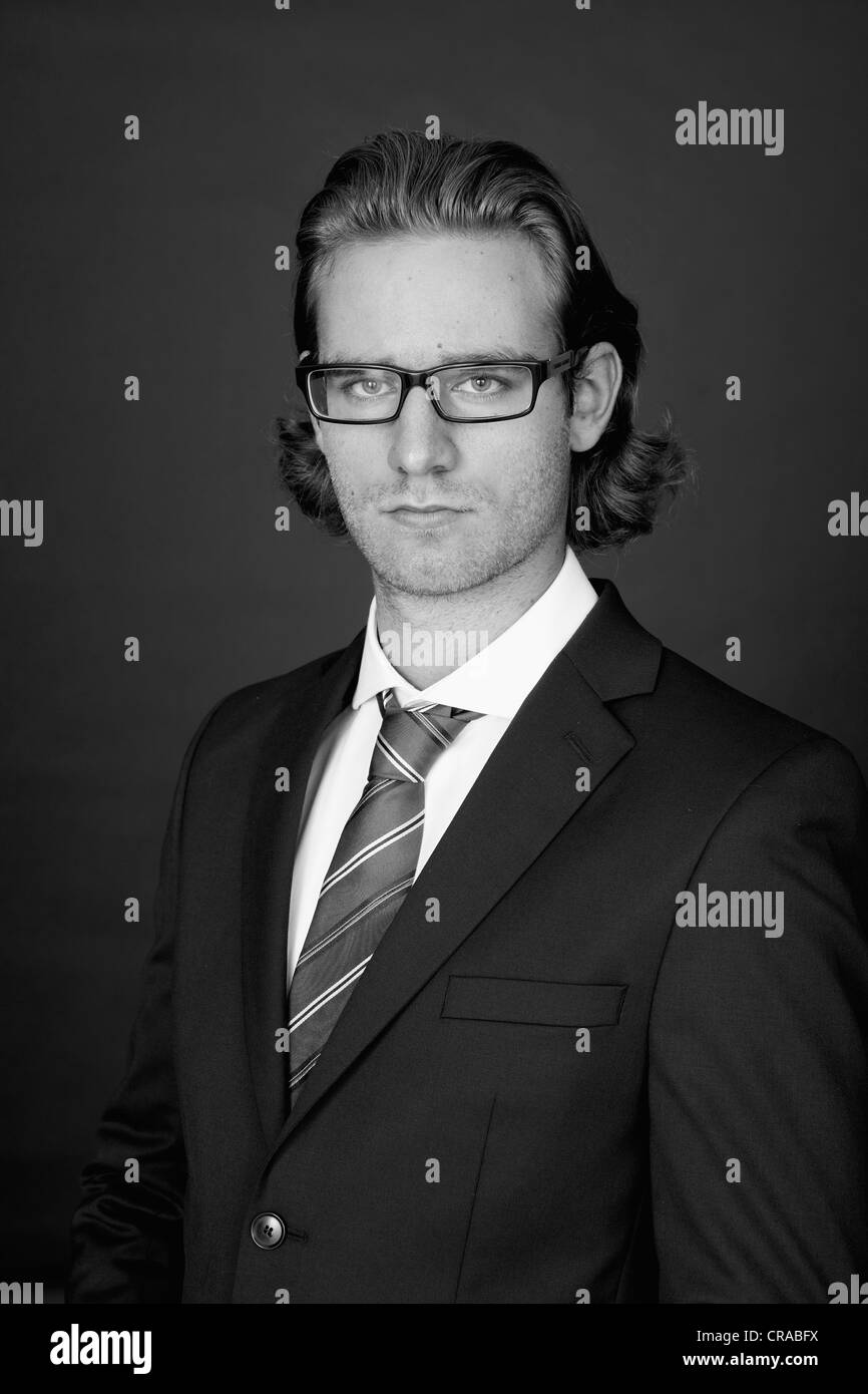 Young man wearing a business suit and glasses, portrait Stock Photo