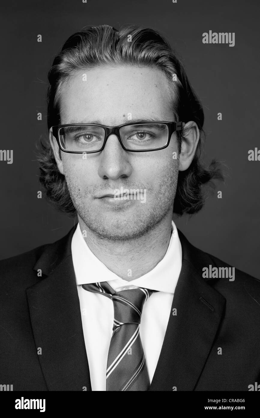 Young man wearing a business suit and glasses, portrait Stock Photo