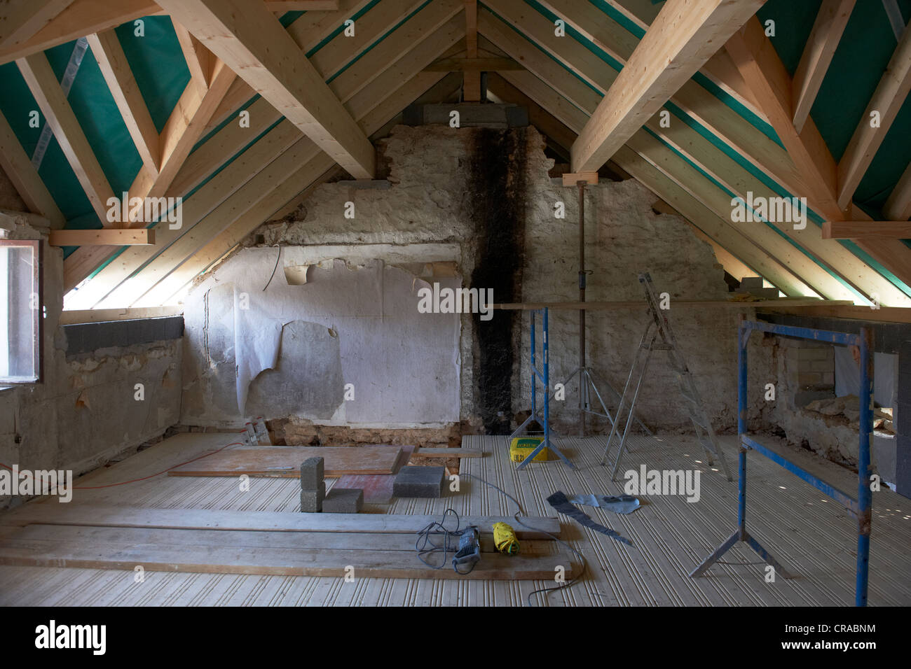 Old farmhouse with a new roof structure Stock Photo