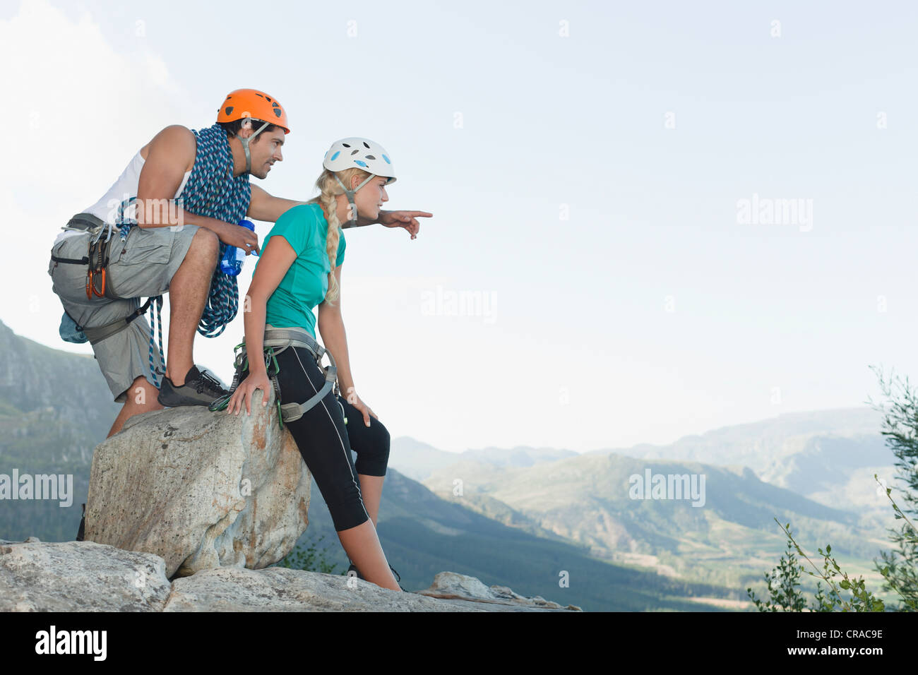 Climbers surveying climb down Stock Photo Alamy