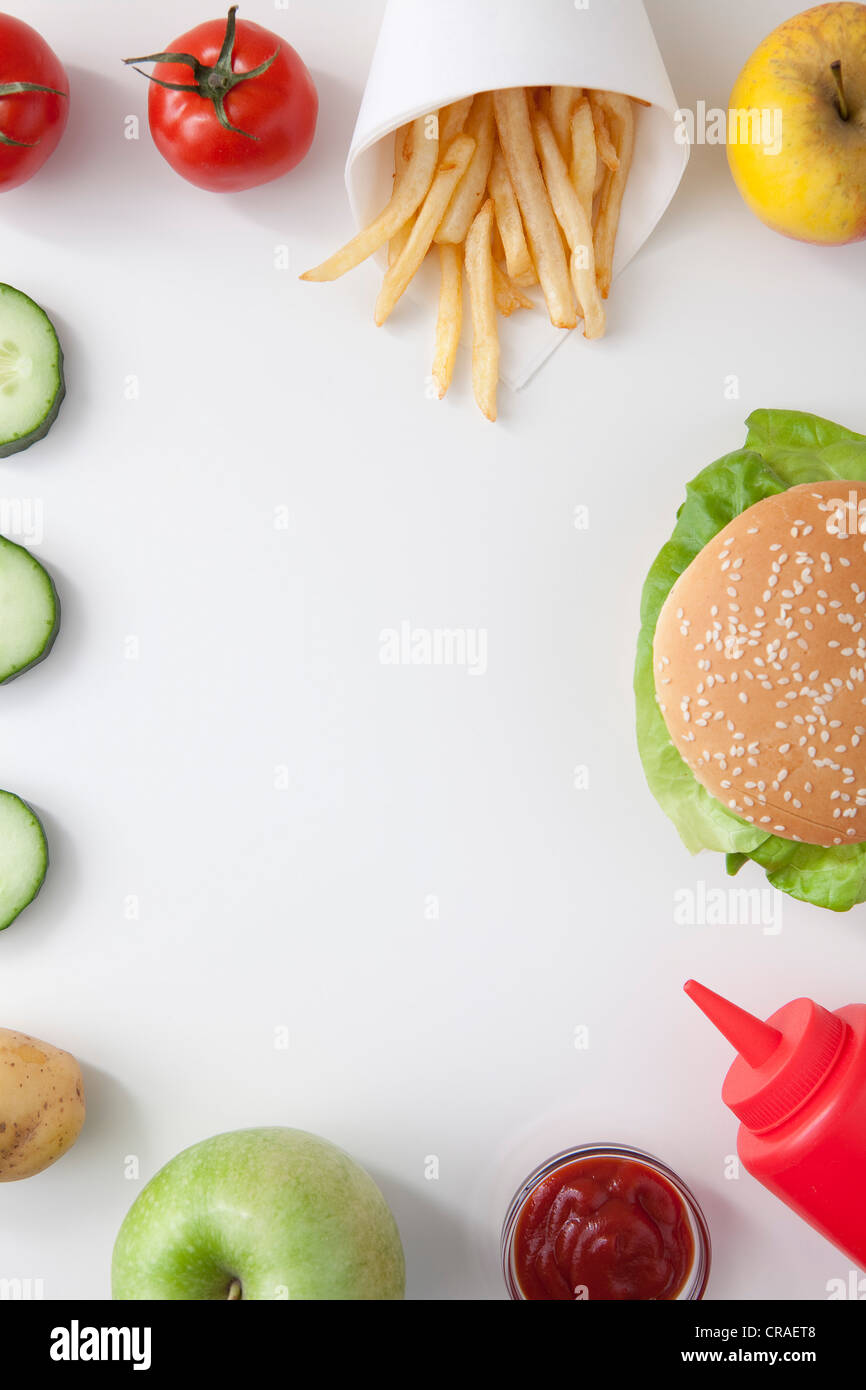 Fruit, vegetables and fries, burger, fast food Stock Photo Alamy