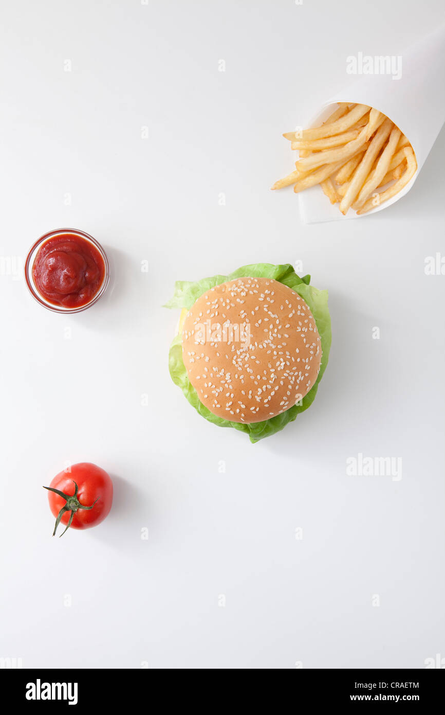 Fast food, burger, fries, ketchup, tomato Stock Photo