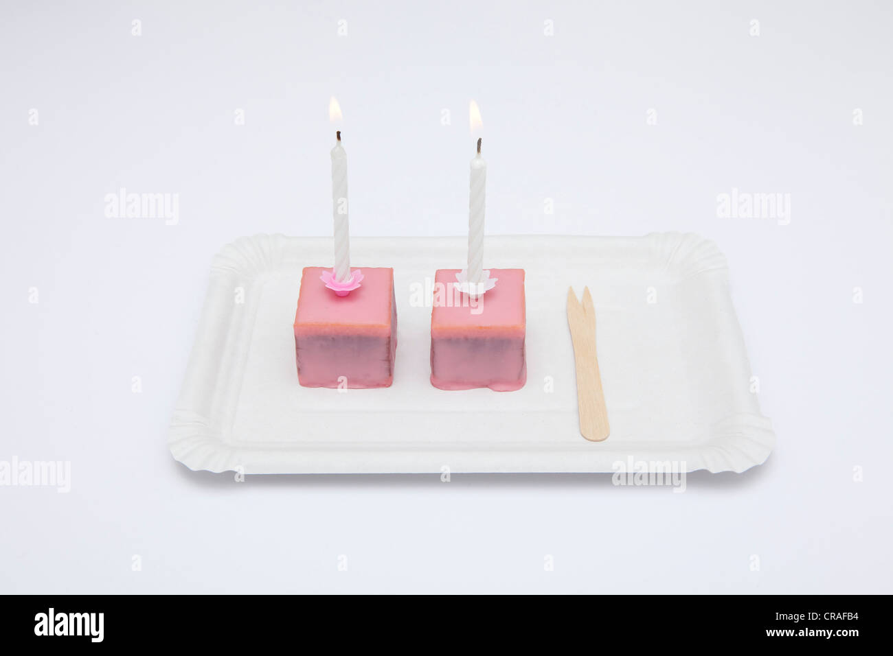 Pink chocolates, birthday candles Stock Photo