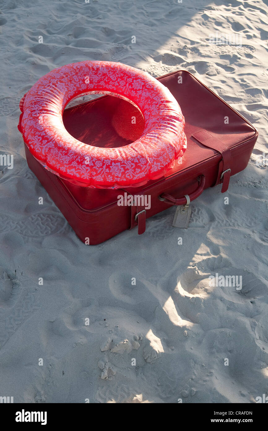 Suitcase with swim ring, beach, summer vacation Stock Photo Alamy