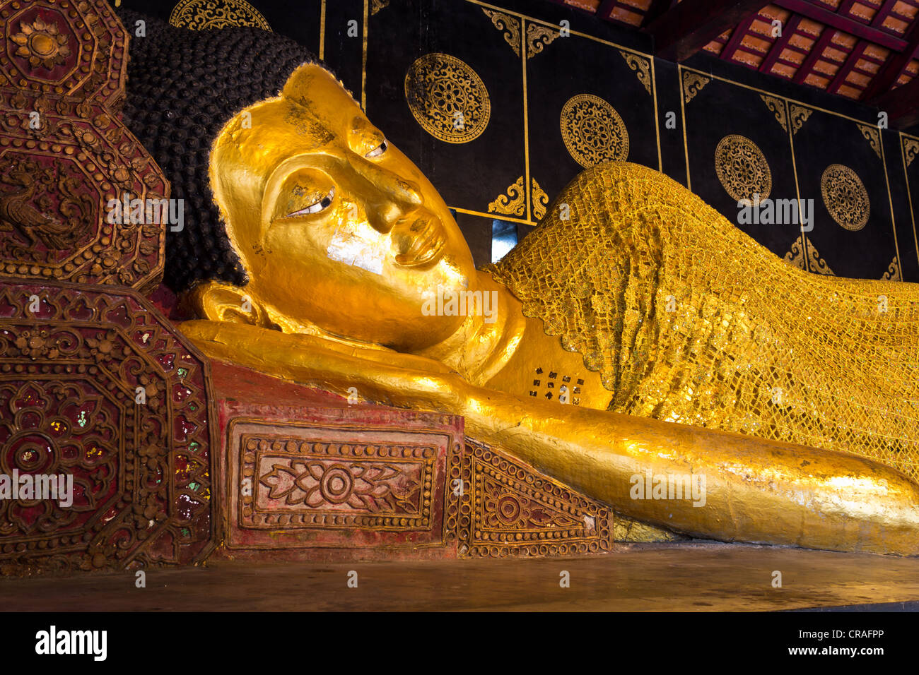 Reclining Buddha image at Wat Thai in Chiangmai. Stock Photo