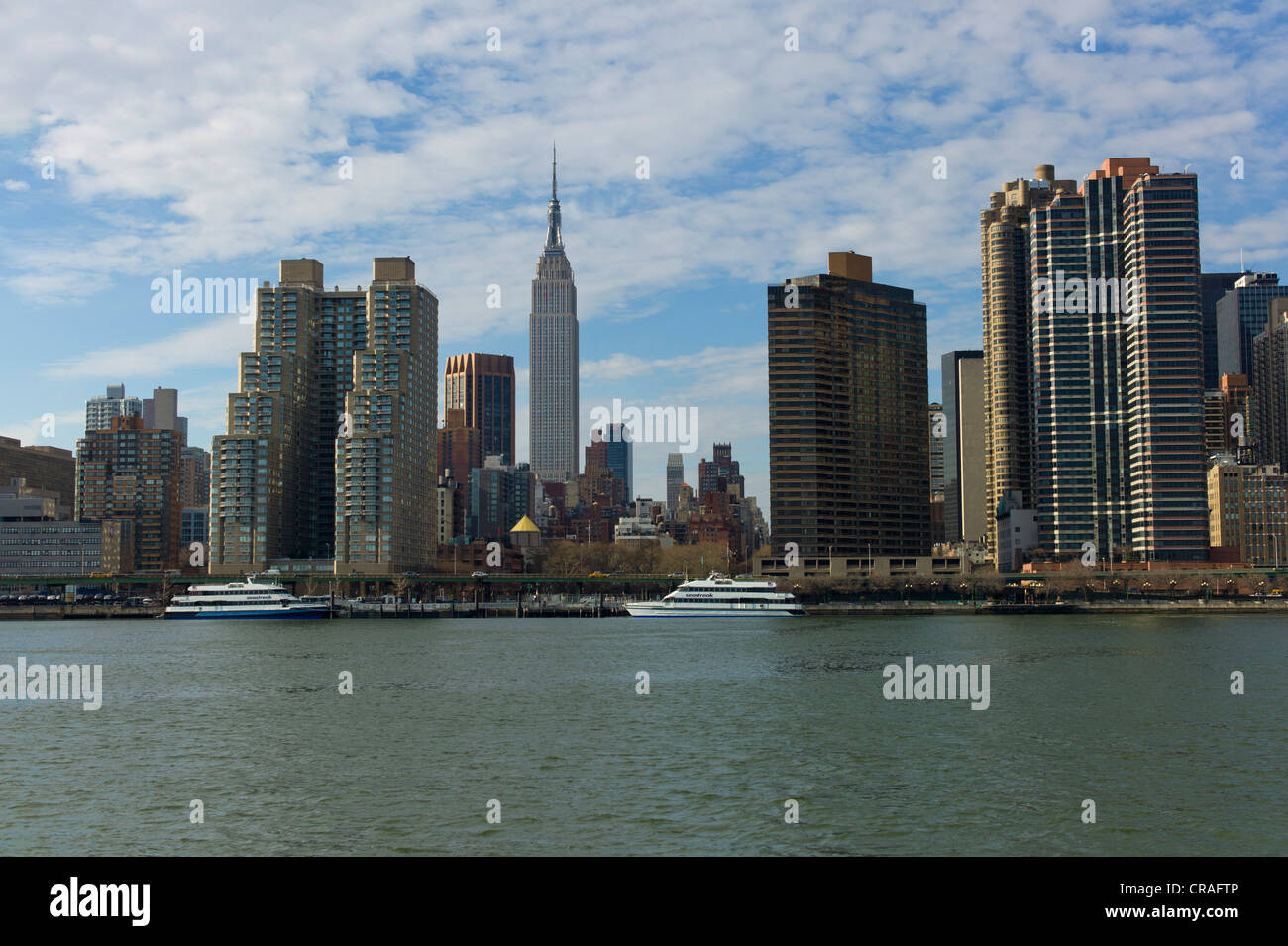 Skyline of New York, East River, the Empire State Building at back, Manhattan, New York USA Stock Photo