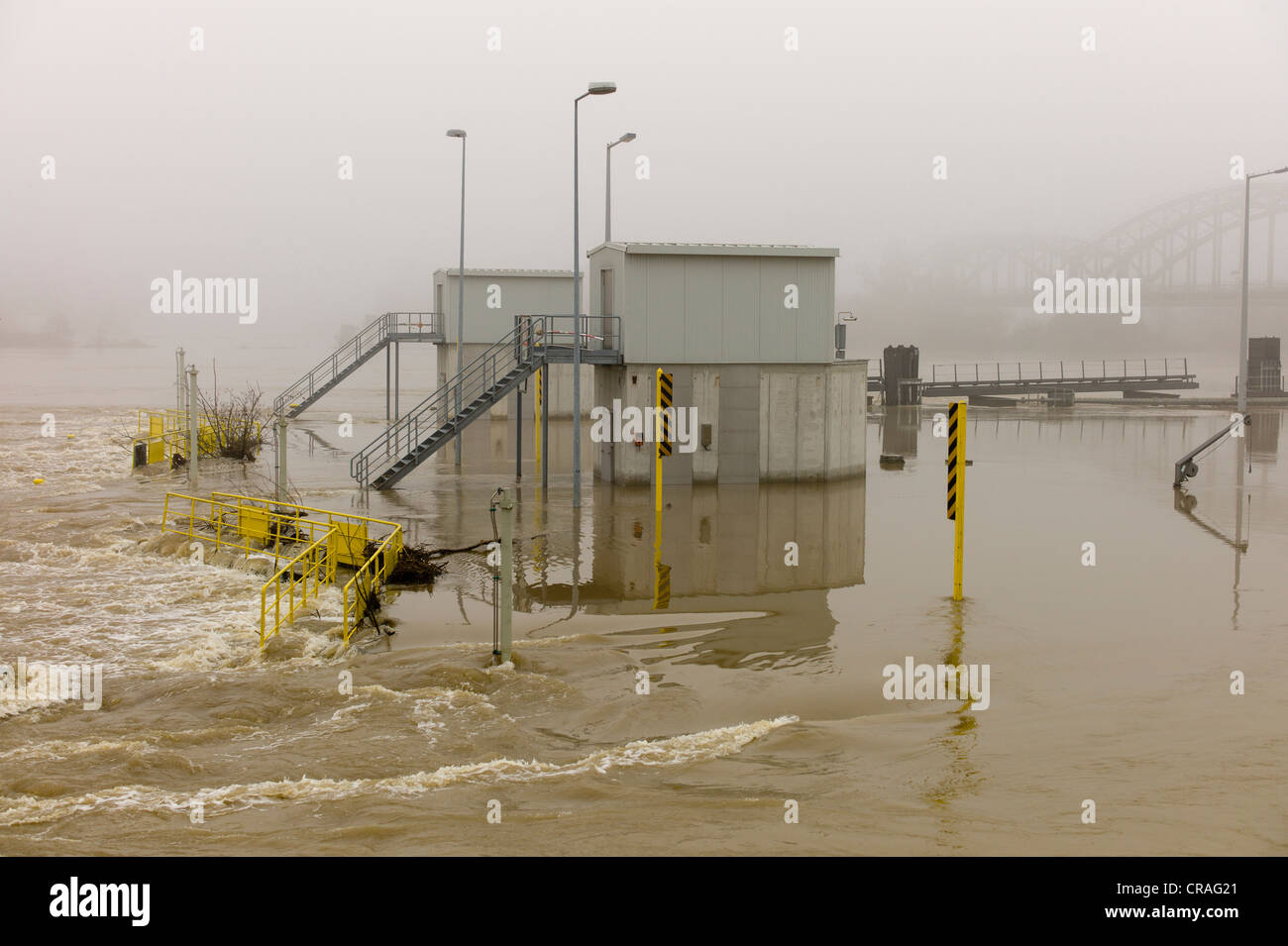 Flooded lock on a foggy day, floodwaters on the Rhine river, Kostheim lock, Ginsheim-Gustavsburg, Germany, Europe Stock Photo