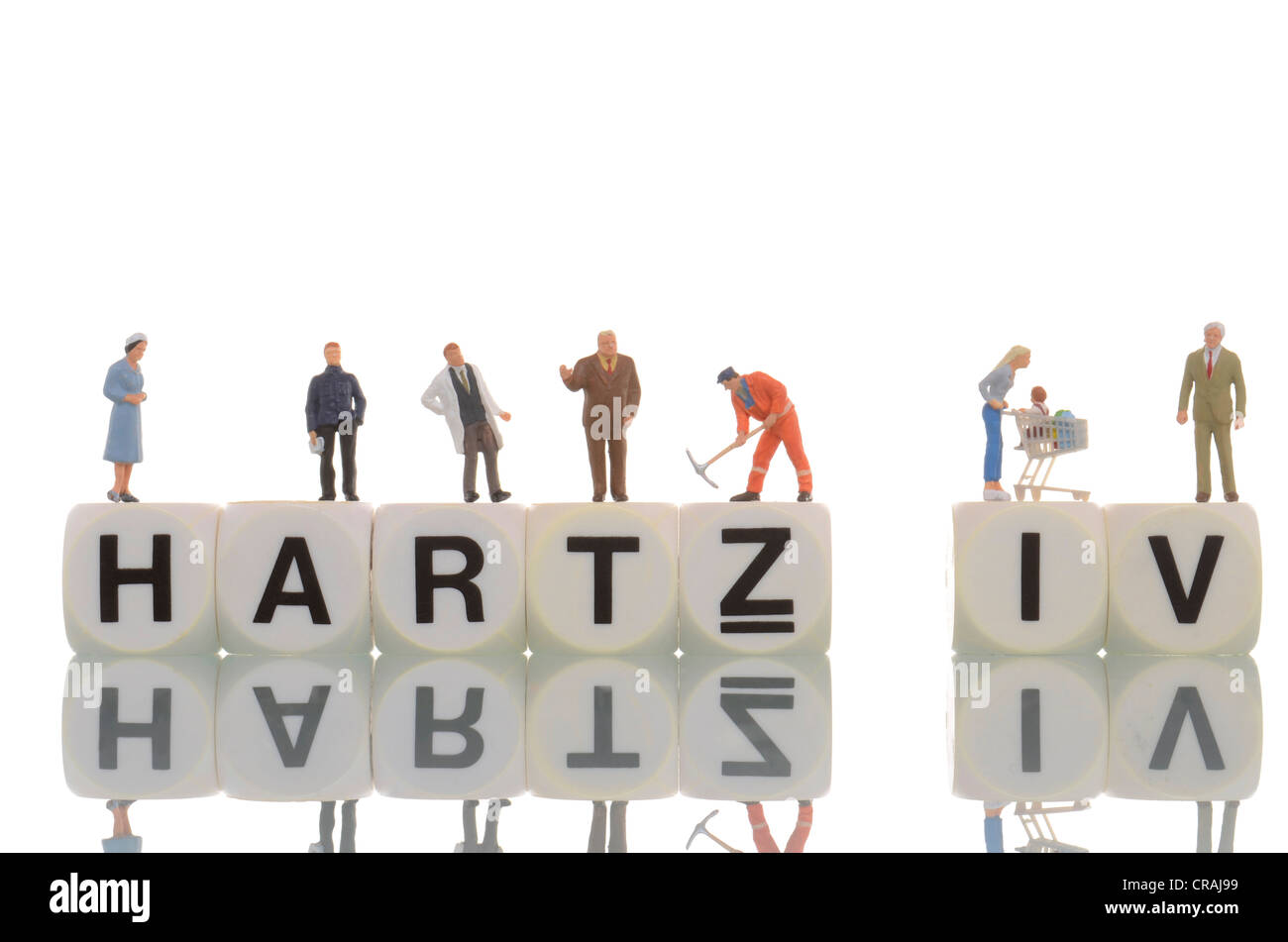 Various figures standing on the words Hartz IV Stock Photo