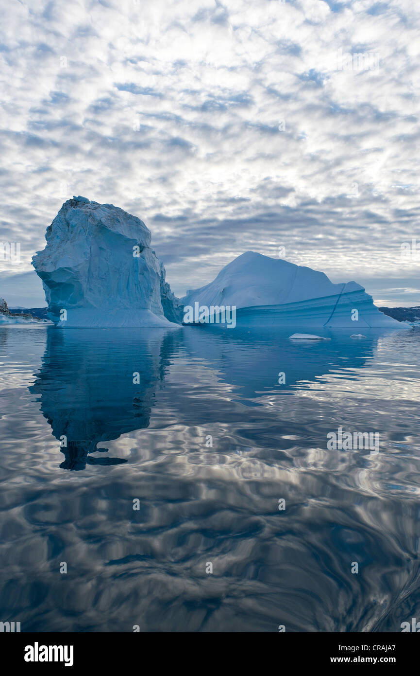 Icebergs with reflection, Sermilik Fjord, East Greenland, Greenland Stock Photo
