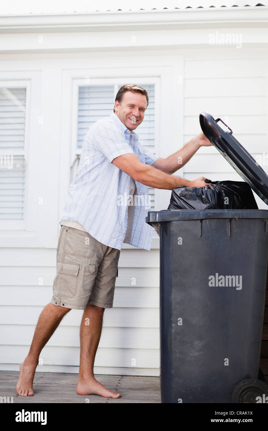 Man taking out the trash hi-res stock photography and images - Alamy