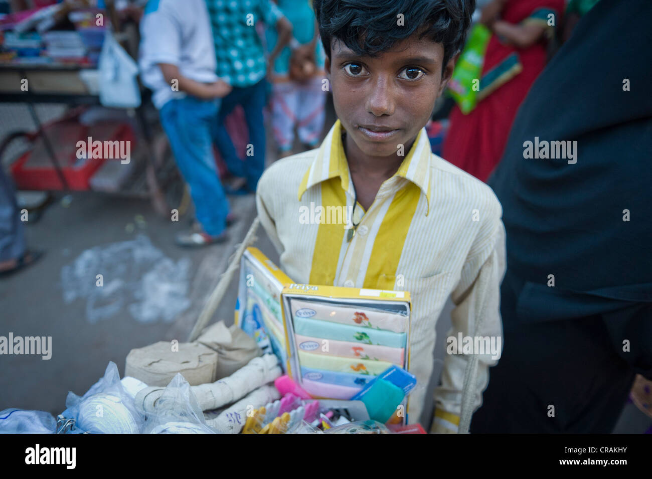 Child selling sewing kits, child labor, bazaar near the Charminar monument, Hyderabad, Andhra Pradesh, India, Asia Stock Photo