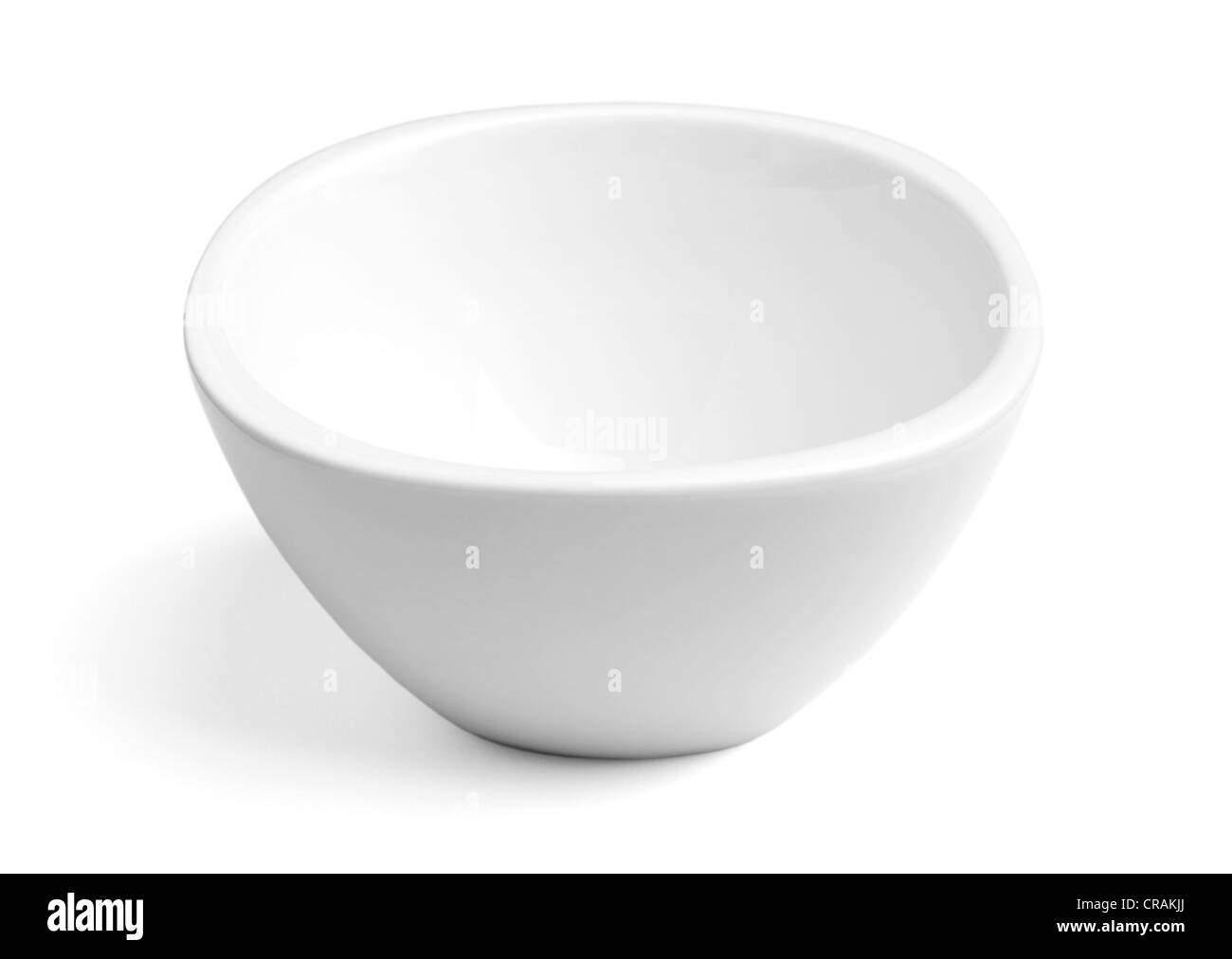 Empty white porcelain dinner bowl on white background with soft natural shadow. Clipping path included Stock Photo