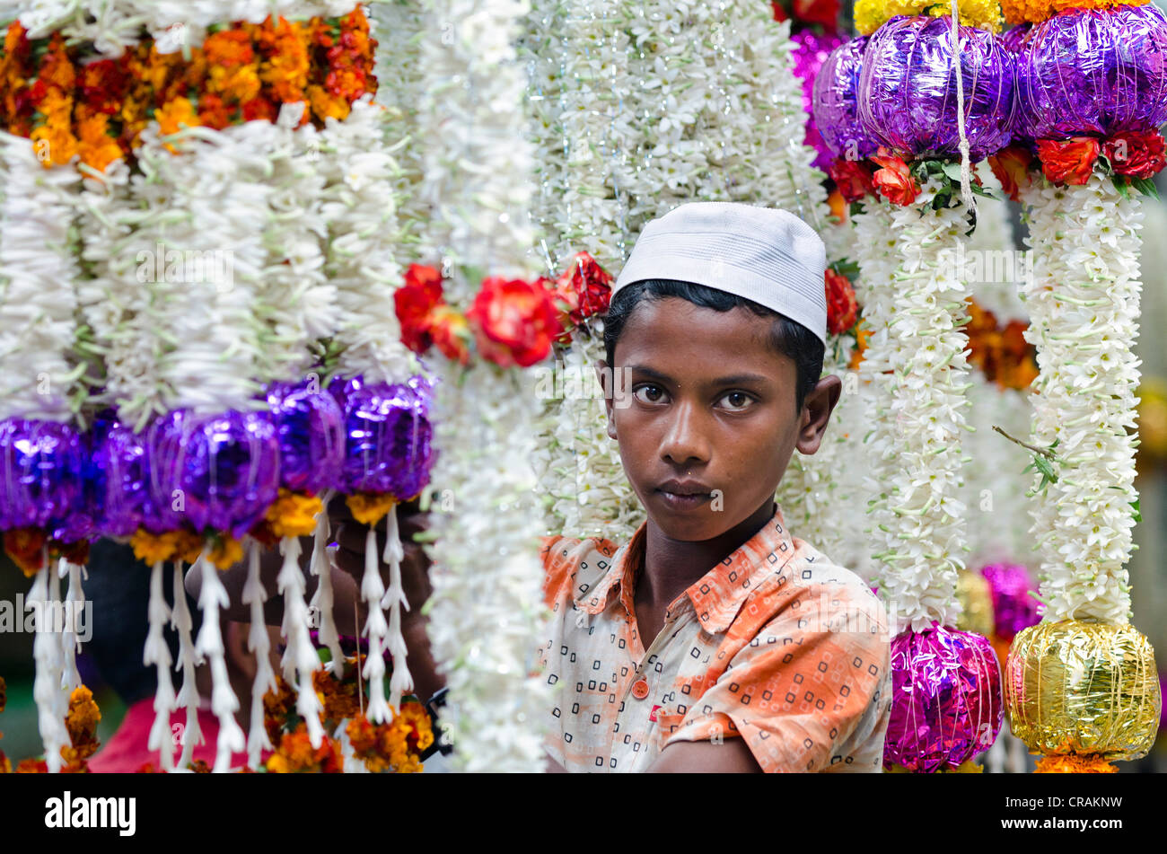 Muslim flower seller, leis or floral garlands, market, Mysore, South India, India, Asia Stock Photo