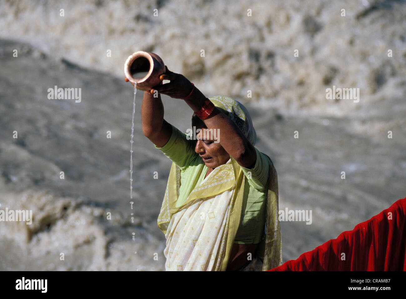 Woman performing a Hindu purification ritual, on the headwaters of the Ganges River, Gangotri