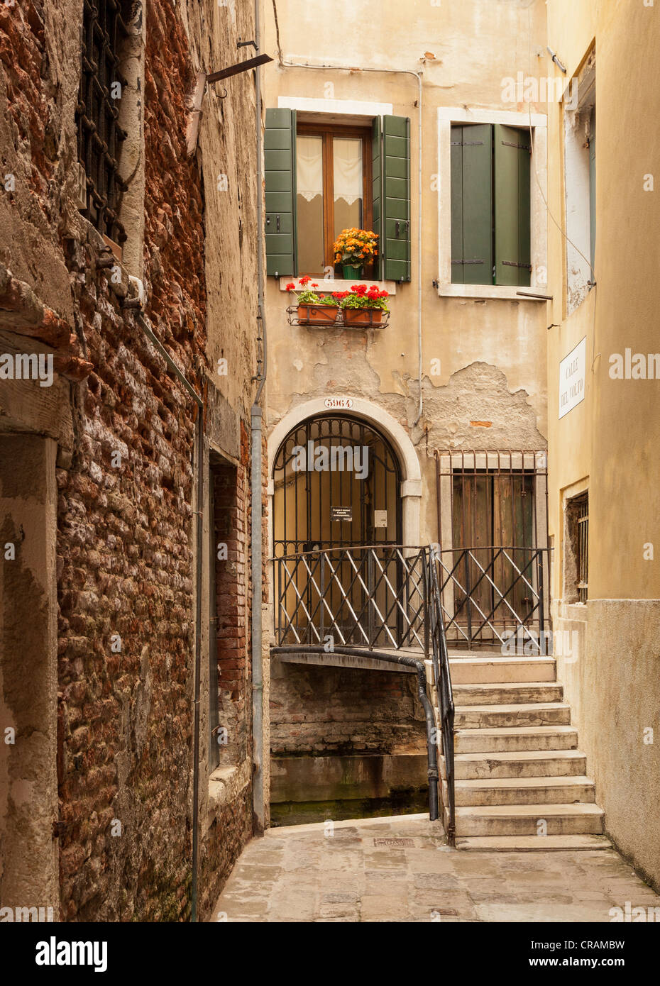 An attractive bridge over a small canal in Venice, Italy Stock Photo