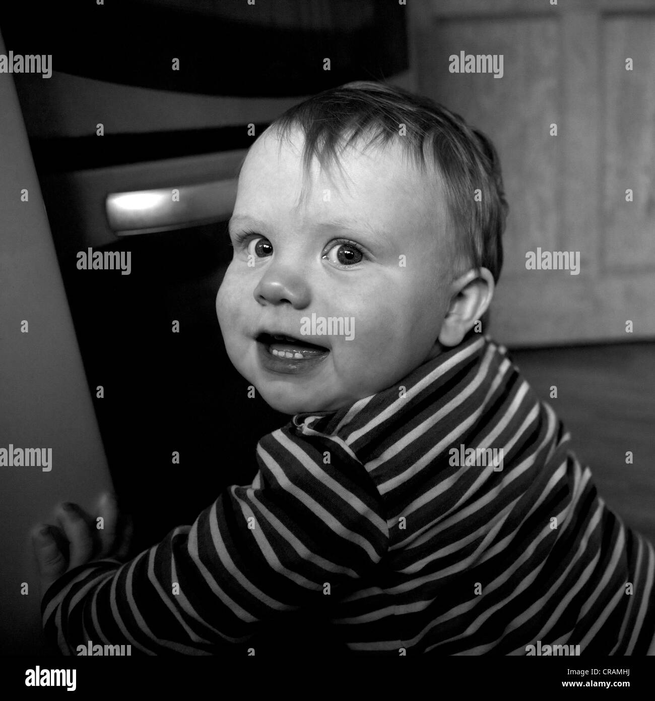 square baby boy excited with big eyes black and white Caucasian Stock Photo