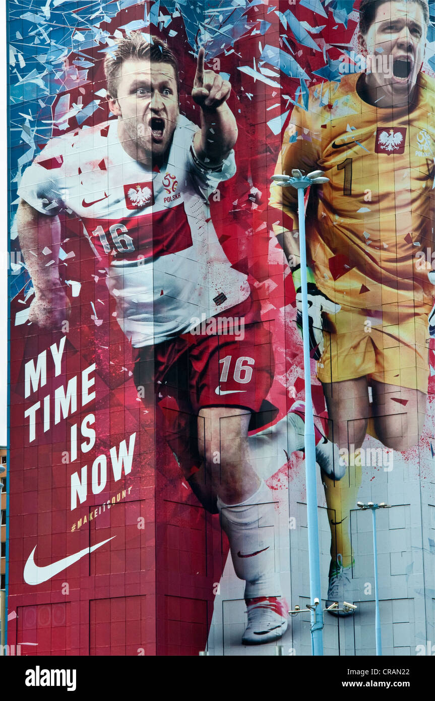 Huge Nike advertisement showing Polish soccer stars, Blaszczykowski and Szczesny, covering 27-floor ORCO Tower in Warsaw, Poland Stock Photo