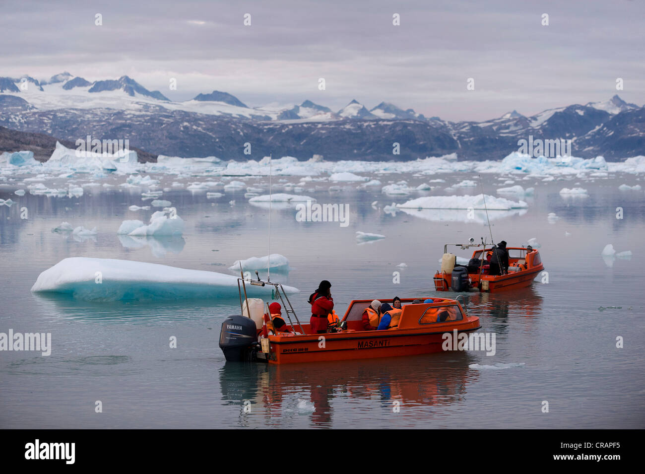 Motor boats with tourists, Johan Petersen Fjord, East Greenland, Greenland Stock Photo