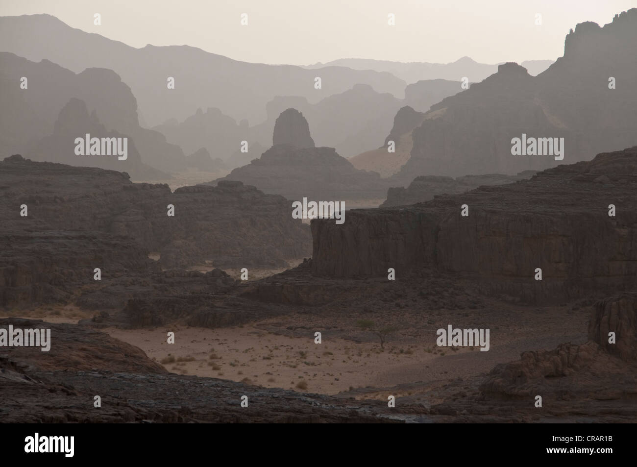 Secluded rocky landscape in haze, Tasset, Algeria, Africa Stock Photo