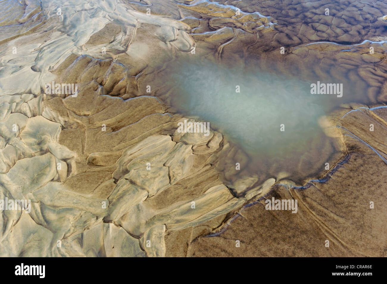 Sand patterns and pool, beach, Ammassalik Peninsula, East Greenland, Greenland Stock Photo