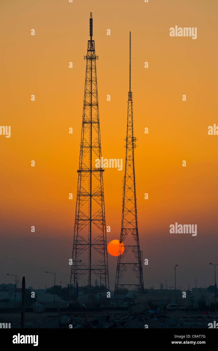 Giant electricity pylon in front of a setting sun, Doha, Qatar, Arabian Peninsula, Middle East Stock Photo