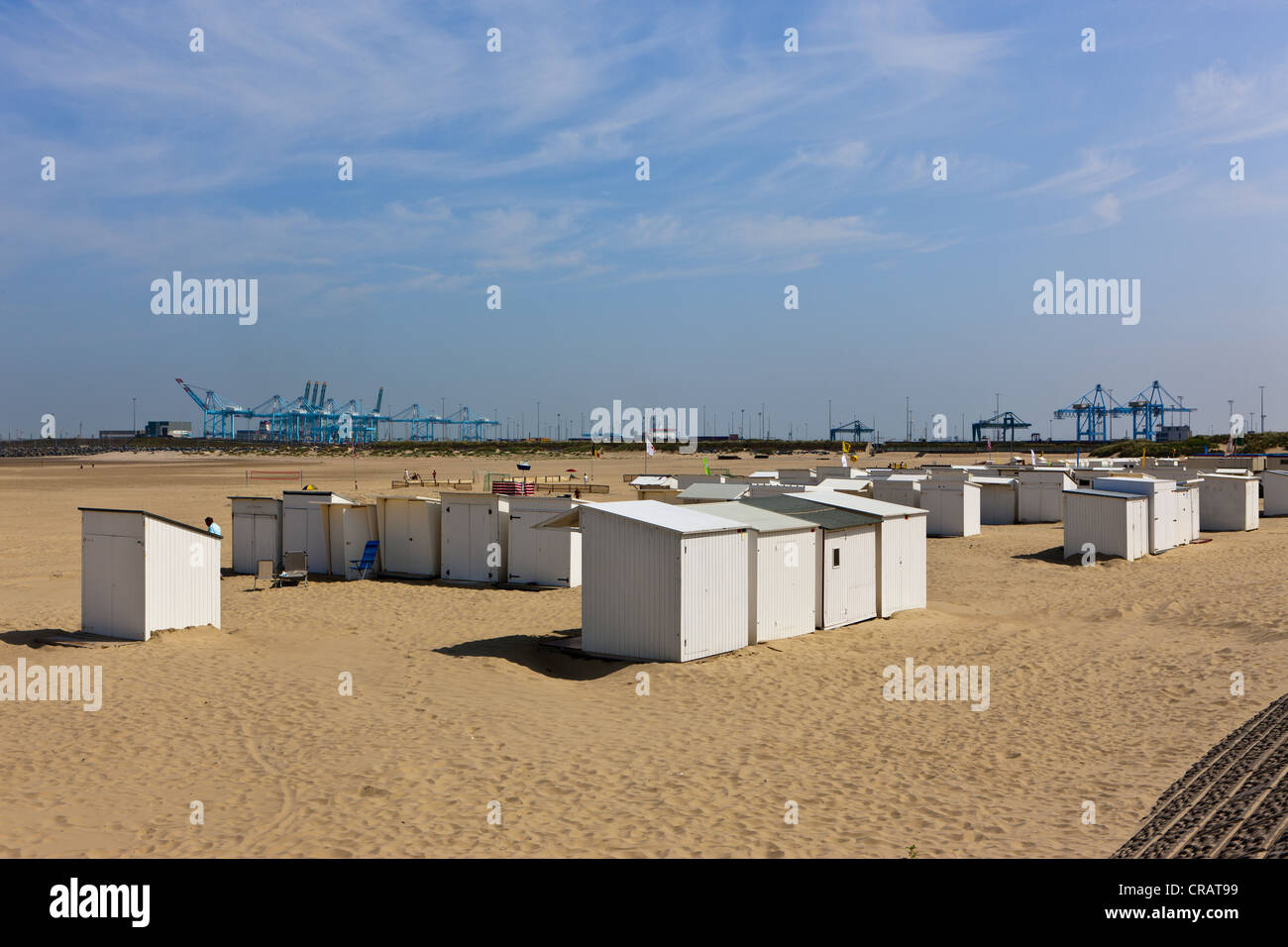 Beach chairs and cranes on the beach of Zeebrugge, West Flanders, Flemish Region, Belgium, Europe Stock Photo