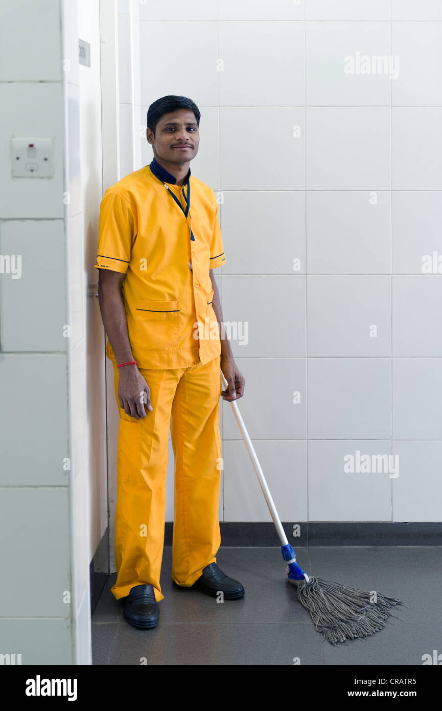 Man cleaning a toilet, Hyderabad Airport, Andhra Pradesh, southern