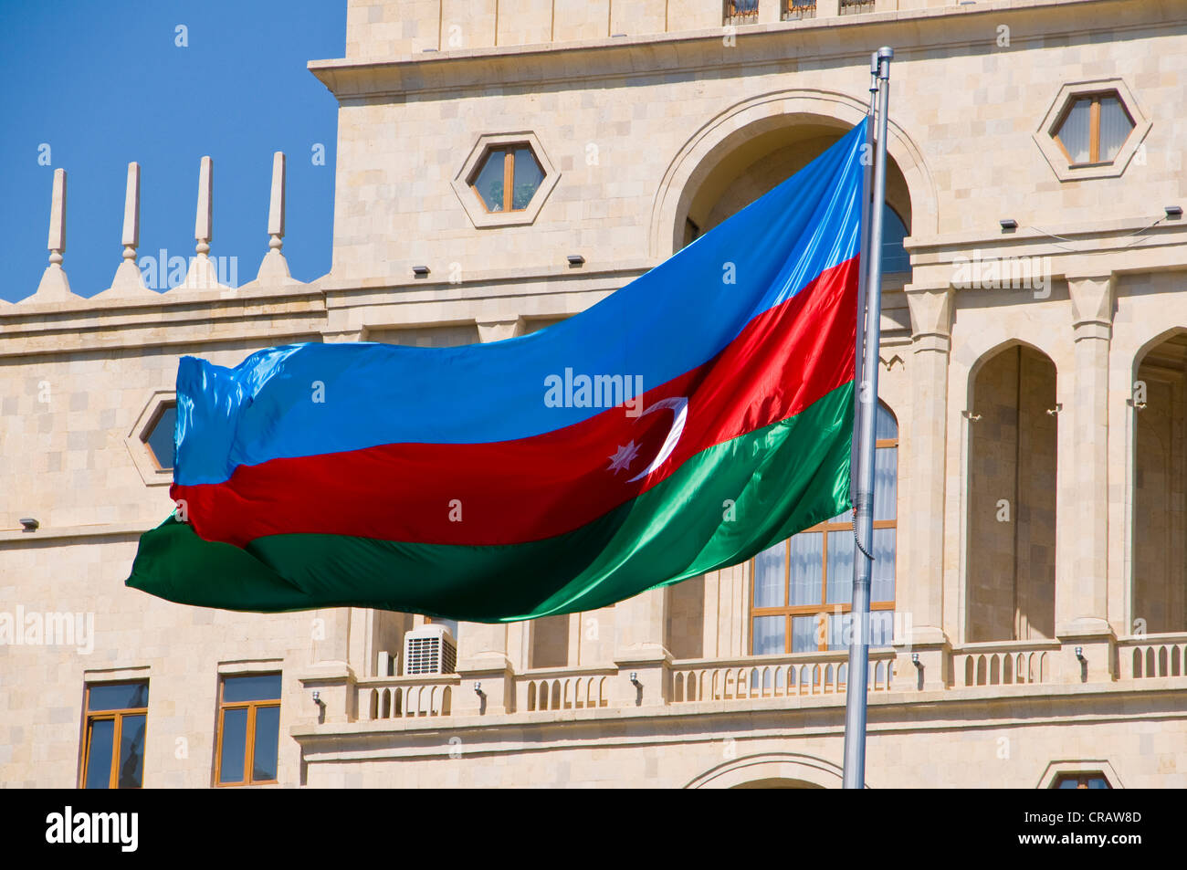 Azerbaijani flag in front of a palace, Baku, Azerbaijan, Middle East Stock Photo