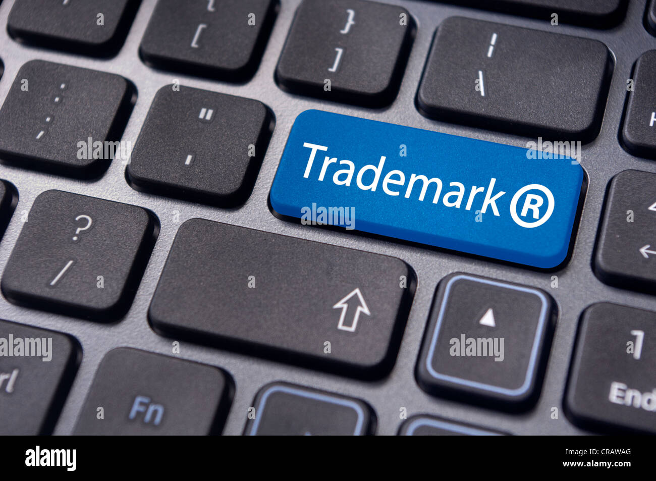 message on keyboard enter key, to illustrate the concepts of trademark. Stock Photo