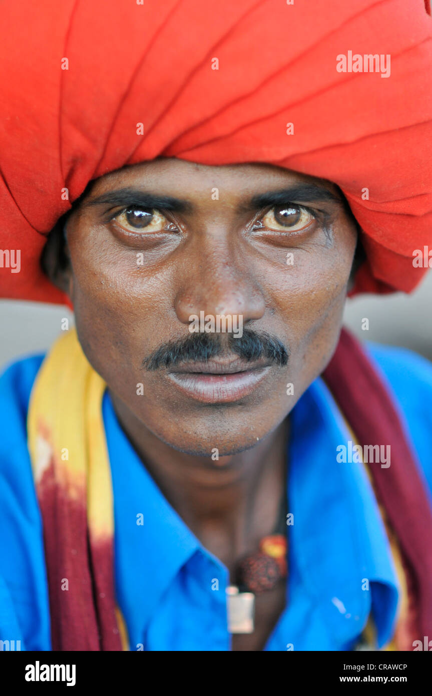 Man wearing a red turban and a blue shirt, Mandu, Madhya Pradesh, India, Asia Stock Photo