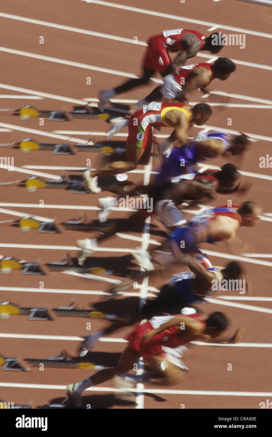 Blurred action of start of men's 100 meter sprints race. Stock Photo